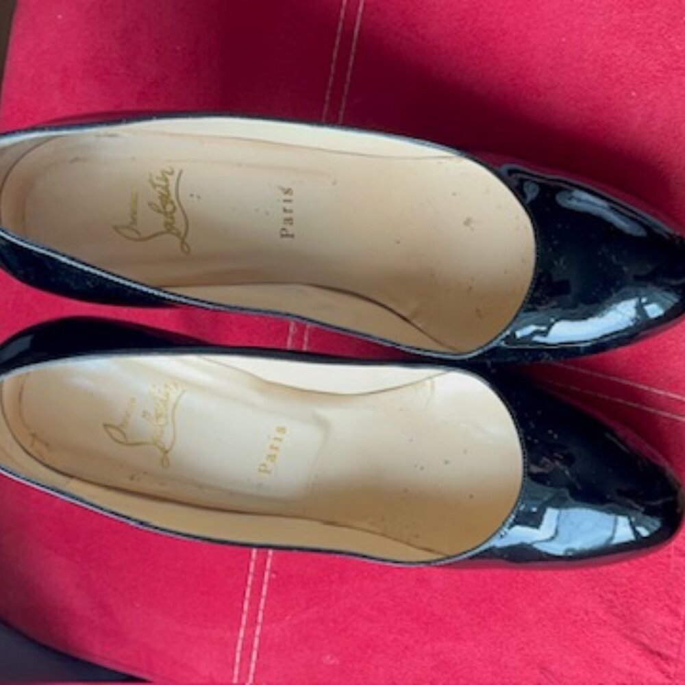 Black Louboutin pumps